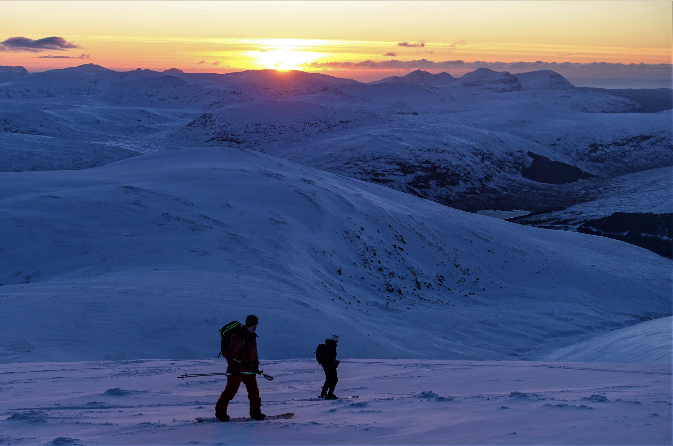 Heading down, skiers Duncan Brown & Blair Duncan
